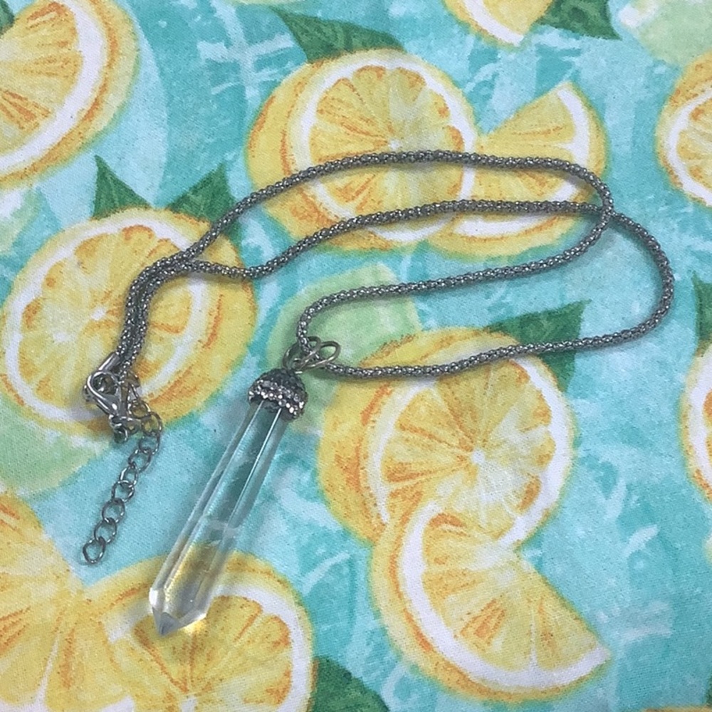 Necklace with crystal pendant with white stones different look.